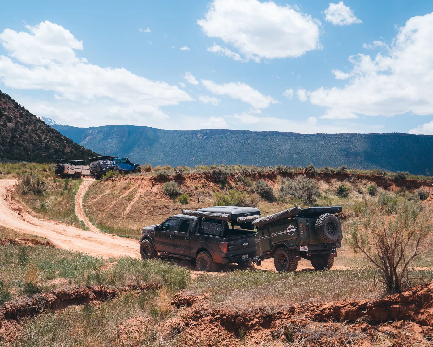 A Koru trailer crossing a wide desert valley
